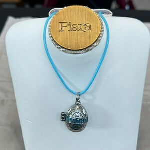 Pendant/locket, Silver tone,  puffed egg shape, magnetic clasp, says FAITH